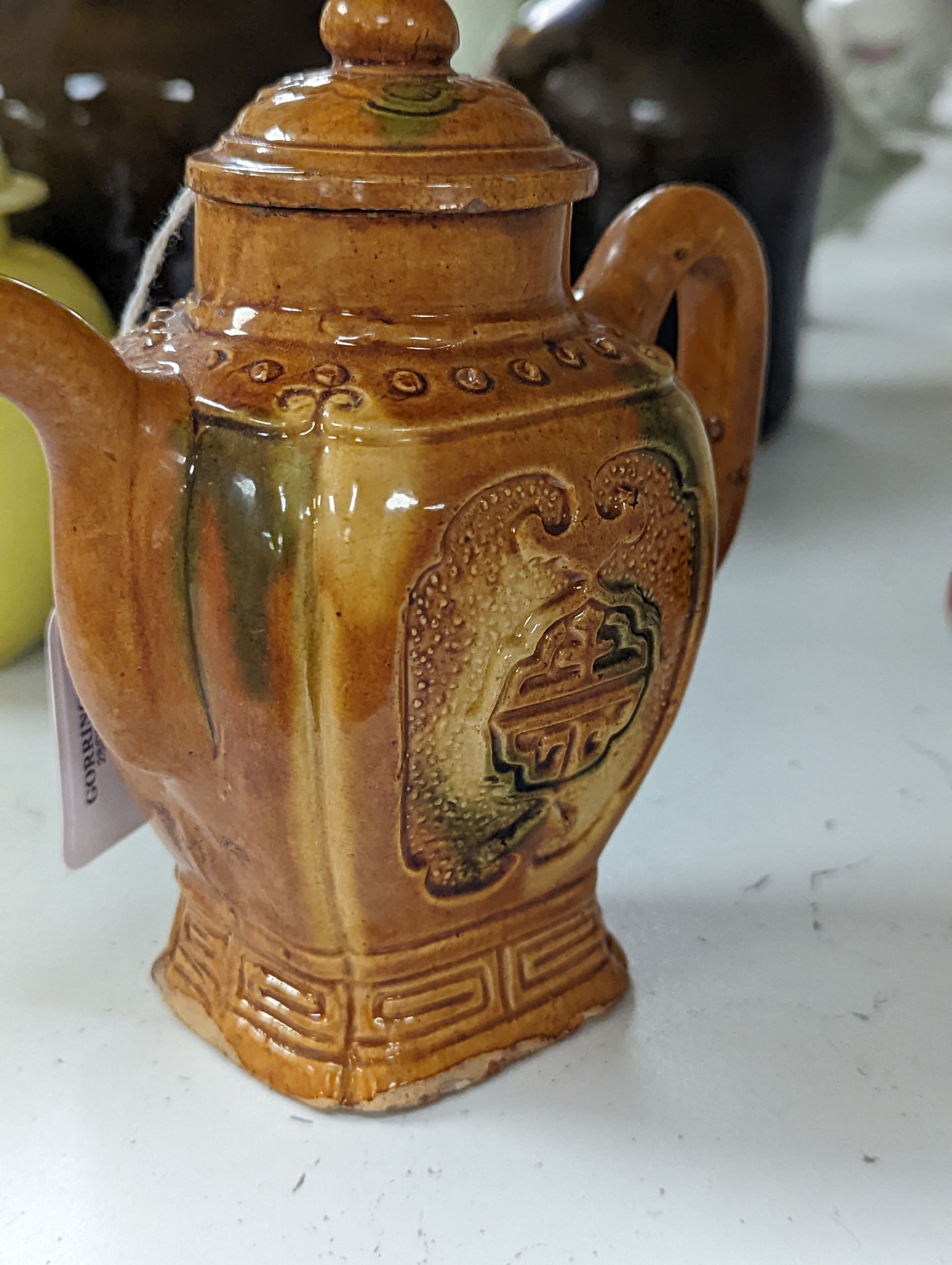 A Chinese enamelled yellow-ground jar and cover, a pottery teapot and cover and a flambe vase, latter 13cm